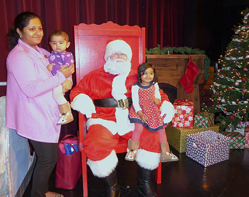 Cozy Family Photo Op with Santa Cozy Family Photo Op with Santa